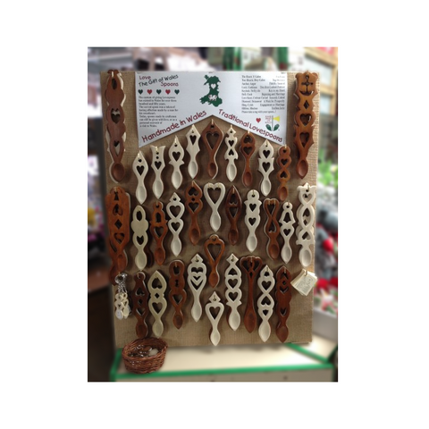 Carved wooden love spoons shop display